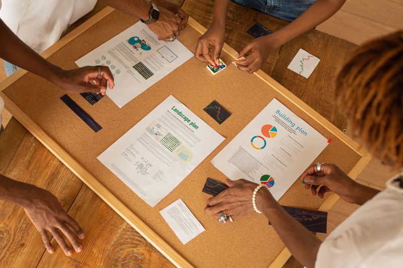 a team looking at a landscape plan, among other documents